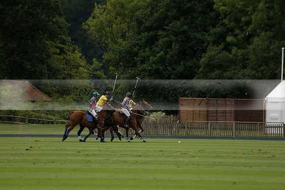 La Tremenda (lilac) v Maiz Dulce (yellow) in a Brecknock Cup polo match played on Lawns 1 at the Cowdray Park Polo Club on Tuesday 13 August 2013