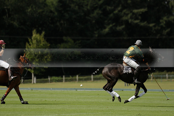 Maiz Dulce (green) v River (blue) in a Uber Polo Midsummer 12 goal polo match on Wednesday 21 August 2013 at Cowdray park Polo Club on Ambersham 2.  www.polopictures.co.uk