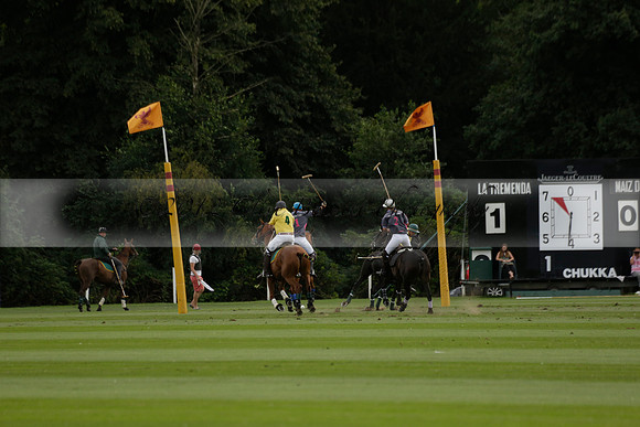 La Tremenda (lilac) v Maiz Dulce (yellow) in a Brecknock Cup polo match played on Lawns 1 at the Cowdray Park Polo Club on Tuesday 13 August 2013