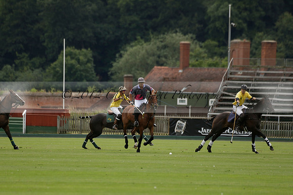 La Tremenda (lilac) v Maiz Dulce (yellow) in a Brecknock Cup polo match played on Lawns 1 at the Cowdray Park Polo Club on Tuesday 13 August 2013