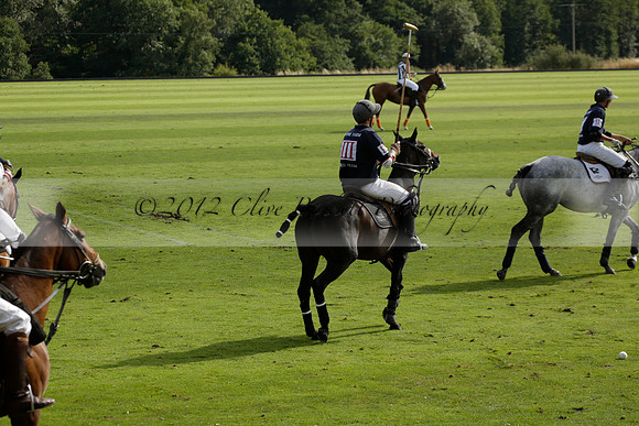 Pandas (white) v Home Farm (navy) in a Park House West Sussex Cup Polo match on Brooksfield at Cowdray Park Polo Club on Friday 30 August 2013. 2013.08.30 www.polopictures.co.uk