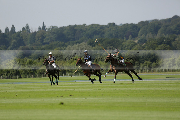 Maiz Dulce (green) v River (blue) in a Uber Polo Midsummer 12 goal polo match on Wednesday 21 August 2013 at Cowdray park Polo Club on Ambersham 2.  www.polopictures.co.uk