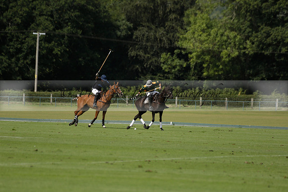 Maiz Dulce (green) v River (blue) in a Uber Polo Midsummer 12 goal polo match on Wednesday 21 August 2013 at Cowdray park Polo Club on Ambersham 2.  www.polopictures.co.uk