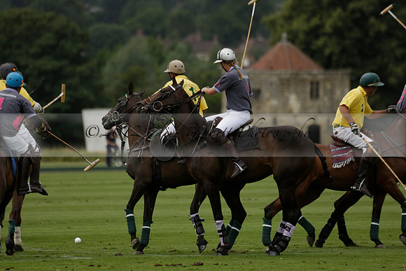 La Tremenda (lilac) v Maiz Dulce (yellow) in a Brecknock Cup polo match played on Lawns 1 at the Cowdray Park Polo Club on Tuesday 13 August 2013
