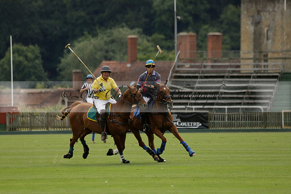 La Tremenda (lilac) v Maiz Dulce (yellow) in a Brecknock Cup polo match played on Lawns 1 at the Cowdray Park Polo Club on Tuesday 13 August 2013