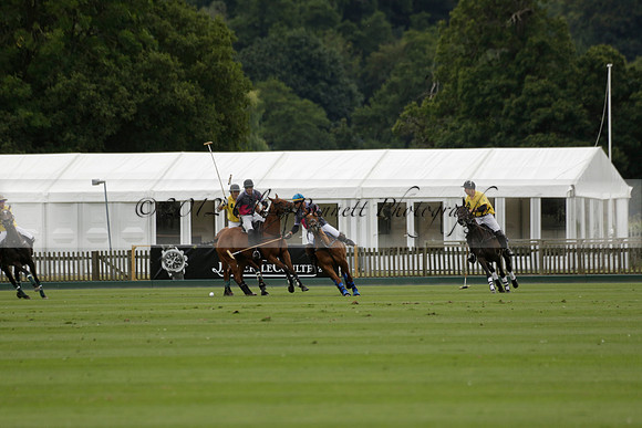 La Tremenda (lilac) v Maiz Dulce (yellow) in a Brecknock Cup polo match played on Lawns 1 at the Cowdray Park Polo Club on Tuesday 13 August 2013