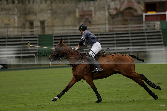 La Tremenda (lilac) v Maiz Dulce (yellow) in a Brecknock Cup polo match played on Lawns 1 at the Cowdray Park Polo Club on Tuesday 13 August 2013
