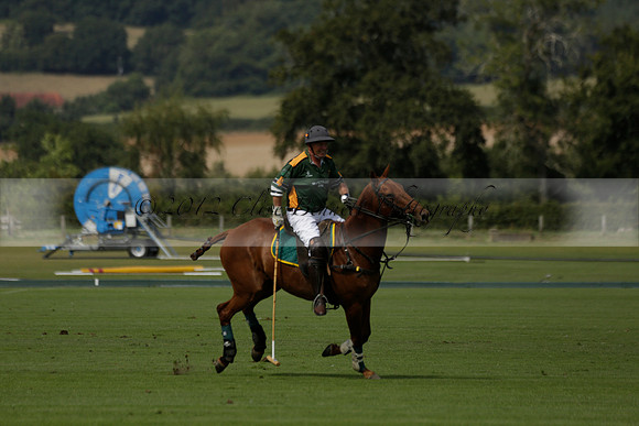 Maiz Dulce (green) v River (blue) in a Uber Polo Midsummer 12 goal polo match on Wednesday 21 August 2013 at Cowdray park Polo Club on Ambersham 2.  www.polopictures.co.uk