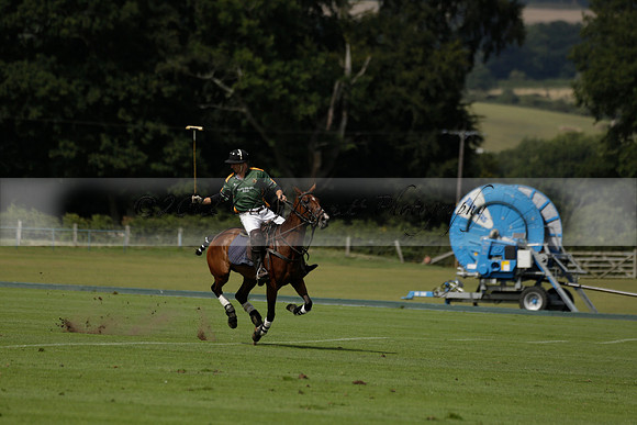 Maiz Dulce (green) v River (blue) in a Uber Polo Midsummer 12 goal polo match on Wednesday 21 August 2013 at Cowdray park Polo Club on Ambersham 2.  www.polopictures.co.uk