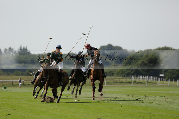 Maiz Dulce (green) v River (blue) in a Uber Polo Midsummer 12 goal polo match on Wednesday 21 August 2013 at Cowdray park Polo Club on Ambersham 2.  www.polopictures.co.uk