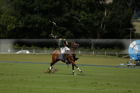 Maiz Dulce (green) v River (blue) in a Uber Polo Midsummer 12 goal polo match on Wednesday 21 August 2013 at Cowdray park Polo Club on Ambersham 2.  www.polopictures.co.uk