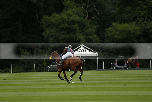 La Tremenda (lilac) v Maiz Dulce (yellow) in a Brecknock Cup polo match played on Lawns 1 at the Cowdray Park Polo Club on Tuesday 13 August 2013