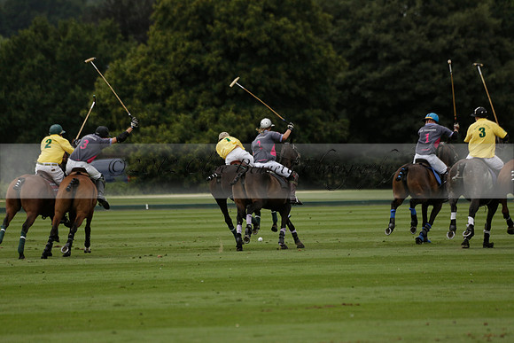 La Tremenda (lilac) v Maiz Dulce (yellow) in a Brecknock Cup polo match played on Lawns 1 at the Cowdray Park Polo Club on Tuesday 13 August 2013