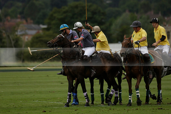 La Tremenda (lilac) v Maiz Dulce (yellow) in a Brecknock Cup polo match played on Lawns 1 at the Cowdray Park Polo Club on Tuesday 13 August 2013