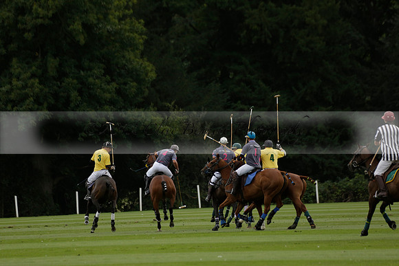 La Tremenda (lilac) v Maiz Dulce (yellow) in a Brecknock Cup polo match played on Lawns 1 at the Cowdray Park Polo Club on Tuesday 13 August 2013
