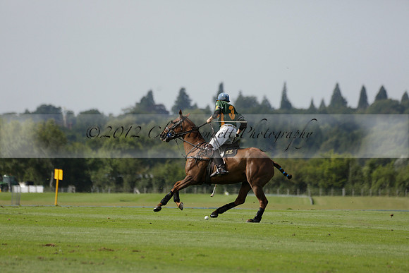 Maiz Dulce (green) v River (blue) in a Uber Polo Midsummer 12 goal polo match on Wednesday 21 August 2013 at Cowdray park Polo Club on Ambersham 2.  www.polopictures.co.uk