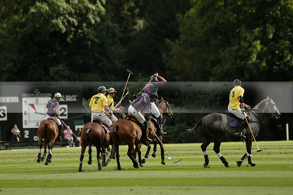La Tremenda (lilac) v Maiz Dulce (yellow) in a Brecknock Cup polo match played on Lawns 1 at the Cowdray Park Polo Club on Tuesday 13 August 2013