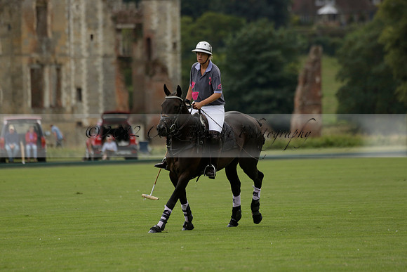 La Tremenda (lilac) v Maiz Dulce (yellow) in a Brecknock Cup polo match played on Lawns 1 at the Cowdray Park Polo Club on Tuesday 13 August 2013