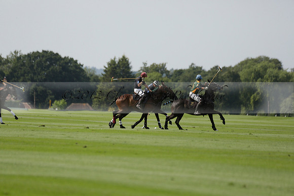 Maiz Dulce (green) v River (blue) in a Uber Polo Midsummer 12 goal polo match on Wednesday 21 August 2013 at Cowdray park Polo Club on Ambersham 2.  www.polopictures.co.uk