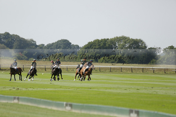 Maiz Dulce (green) v River (blue) in a Uber Polo Midsummer 12 goal polo match on Wednesday 21 August 2013 at Cowdray park Polo Club on Ambersham 2.  www.polopictures.co.uk