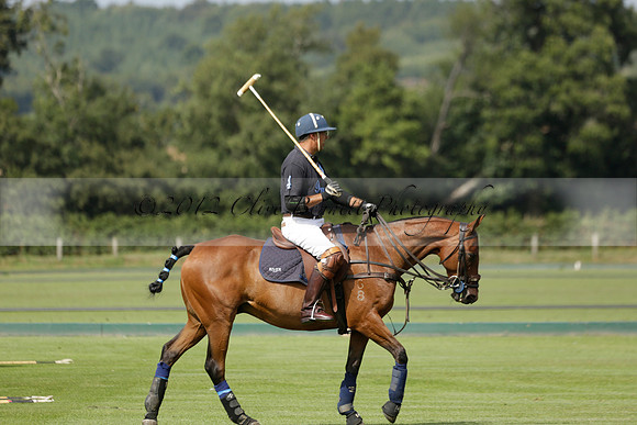 Maiz Dulce (green) v River (blue) in a Uber Polo Midsummer 12 goal polo match on Wednesday 21 August 2013 at Cowdray park Polo Club on Ambersham 2.  www.polopictures.co.uk