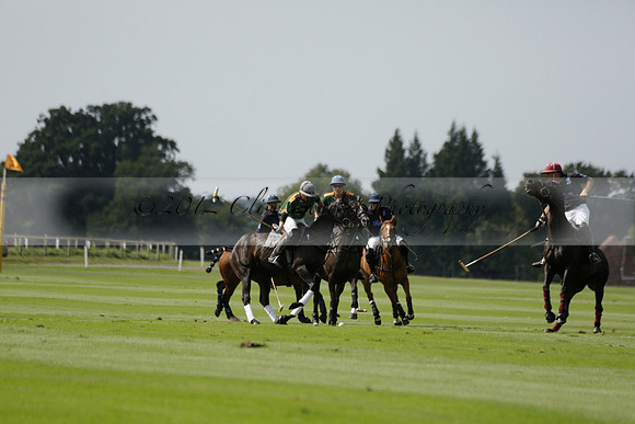 Maiz Dulce (green) v River (blue) in a Uber Polo Midsummer 12 goal polo match on Wednesday 21 August 2013 at Cowdray park Polo Club on Ambersham 2.  www.polopictures.co.uk