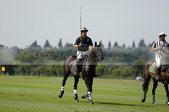 Maiz Dulce (green) v River (blue) in a Uber Polo Midsummer 12 goal polo match on Wednesday 21 August 2013 at Cowdray park Polo Club on Ambersham 2.  www.polopictures.co.uk