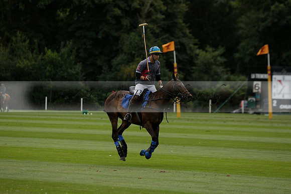 La Tremenda (lilac) v Maiz Dulce (yellow) in a Brecknock Cup polo match played on Lawns 1 at the Cowdray Park Polo Club on Tuesday 13 August 2013