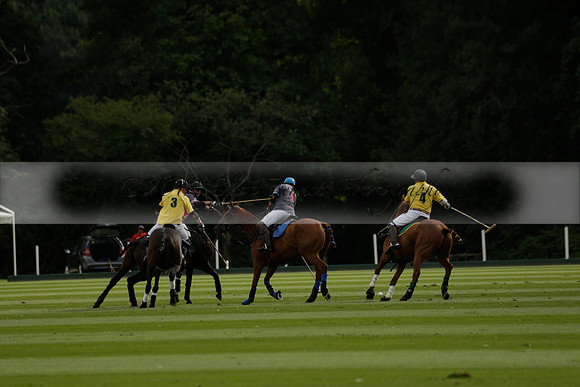 La Tremenda (lilac) v Maiz Dulce (yellow) in a Brecknock Cup polo match played on Lawns 1 at the Cowdray Park Polo Club on Tuesday 13 August 2013