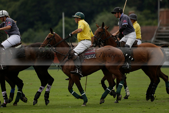 La Tremenda (lilac) v Maiz Dulce (yellow) in a Brecknock Cup polo match played on Lawns 1 at the Cowdray Park Polo Club on Tuesday 13 August 2013