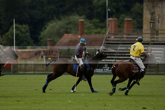 La Tremenda (lilac) v Maiz Dulce (yellow) in a Brecknock Cup polo match played on Lawns 1 at the Cowdray Park Polo Club on Tuesday 13 August 2013