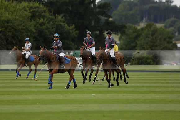 La Tremenda (lilac) v Maiz Dulce (yellow) in a Brecknock Cup polo match played on Lawns 1 at the Cowdray Park Polo Club on Tuesday 13 August 2013