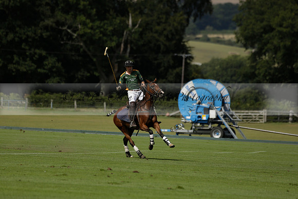 Maiz Dulce (green) v River (blue) in a Uber Polo Midsummer 12 goal polo match on Wednesday 21 August 2013 at Cowdray park Polo Club on Ambersham 2.  www.polopictures.co.uk