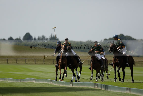 Maiz Dulce (green) v River (blue) in a Uber Polo Midsummer 12 goal polo match on Wednesday 21 August 2013 at Cowdray park Polo Club on Ambersham 2.  www.polopictures.co.uk