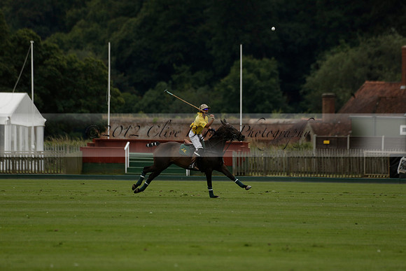 La Tremenda (lilac) v Maiz Dulce (yellow) in a Brecknock Cup polo match played on Lawns 1 at the Cowdray Park Polo Club on Tuesday 13 August 2013