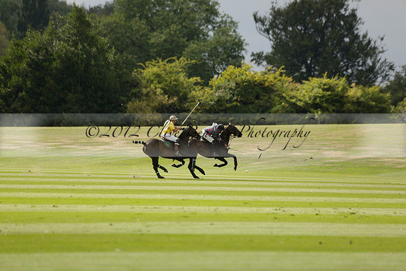 La Tremenda (lilac) v Maiz Dulce (yellow) in a Brecknock Cup polo match played on Lawns 1 at the Cowdray Park Polo Club on Tuesday 13 August 2013
