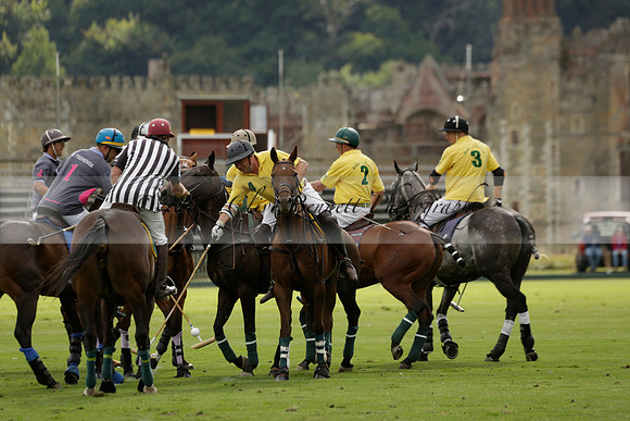 La Tremenda (lilac) v Maiz Dulce (yellow) in a Brecknock Cup polo match played on Lawns 1 at the Cowdray Park Polo Club on Tuesday 13 August 2013