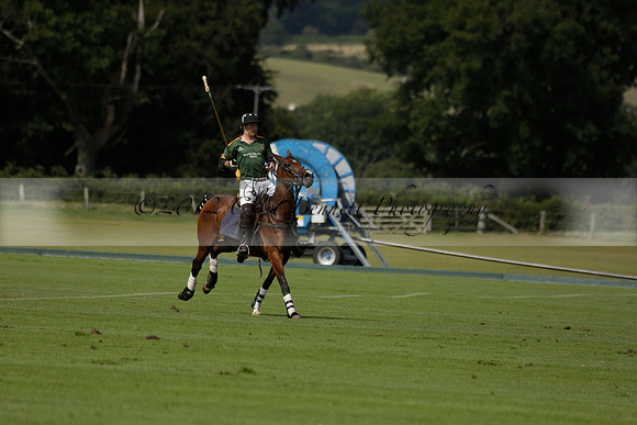 Maiz Dulce (green) v River (blue) in a Uber Polo Midsummer 12 goal polo match on Wednesday 21 August 2013 at Cowdray park Polo Club on Ambersham 2.  www.polopictures.co.uk