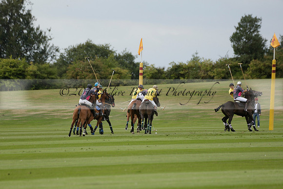 La Tremenda (lilac) v Maiz Dulce (yellow) in a Brecknock Cup polo match played on Lawns 1 at the Cowdray Park Polo Club on Tuesday 13 August 2013
