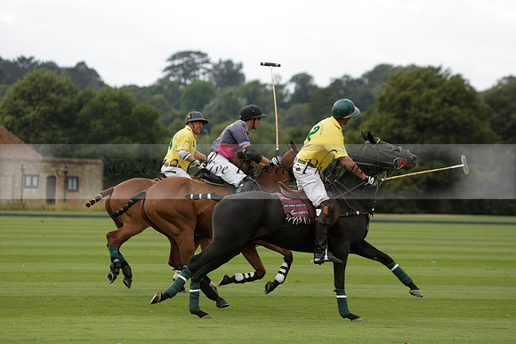 La Tremenda (lilac) v Maiz Dulce (yellow) in a Brecknock Cup polo match played on Lawns 1 at the Cowdray Park Polo Club on Tuesday 13 August 2013