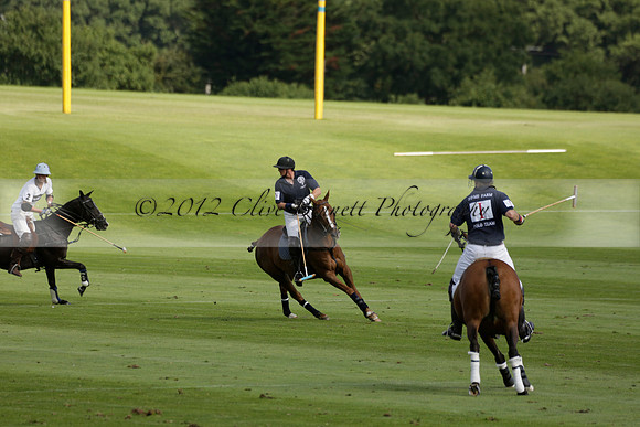 Pandas (white) v Home Farm (navy) in a Park House West Sussex Cup Polo match on Brooksfield at Cowdray Park Polo Club on Friday 30 August 2013. 2013.08.30 www.polopictures.co.uk