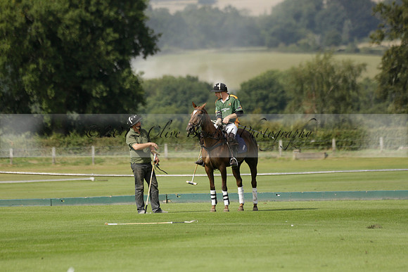 Maiz Dulce (green) v River (blue) in a Uber Polo Midsummer 12 goal polo match on Wednesday 21 August 2013 at Cowdray park Polo Club on Ambersham 2.  www.polopictures.co.uk