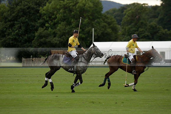 La Tremenda (lilac) v Maiz Dulce (yellow) in a Brecknock Cup polo match played on Lawns 1 at the Cowdray Park Polo Club on Tuesday 13 August 2013