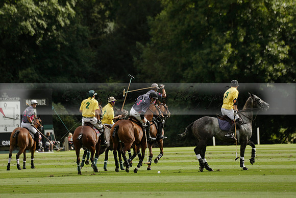 La Tremenda (lilac) v Maiz Dulce (yellow) in a Brecknock Cup polo match played on Lawns 1 at the Cowdray Park Polo Club on Tuesday 13 August 2013