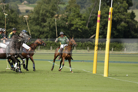 Maiz Dulce (green) v River (blue) in a Uber Polo Midsummer 12 goal polo match on Wednesday 21 August 2013 at Cowdray park Polo Club on Ambersham 2.  www.polopictures.co.uk