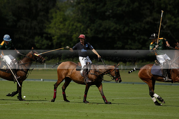 Maiz Dulce (green) v River (blue) in a Uber Polo Midsummer 12 goal polo match on Wednesday 21 August 2013 at Cowdray park Polo Club on Ambersham 2.  www.polopictures.co.uk