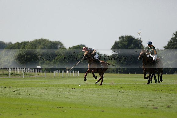 Maiz Dulce (green) v River (blue) in a Uber Polo Midsummer 12 goal polo match on Wednesday 21 August 2013 at Cowdray park Polo Club on Ambersham 2.  www.polopictures.co.uk