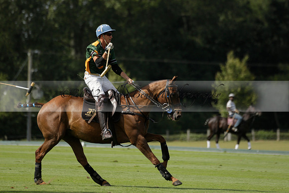 Maiz Dulce (green) v River (blue) in a Uber Polo Midsummer 12 goal polo match on Wednesday 21 August 2013 at Cowdray park Polo Club on Ambersham 2.  www.polopictures.co.uk
