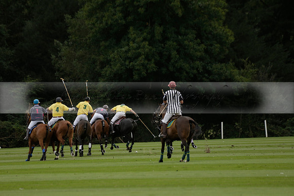 La Tremenda (lilac) v Maiz Dulce (yellow) in a Brecknock Cup polo match played on Lawns 1 at the Cowdray Park Polo Club on Tuesday 13 August 2013