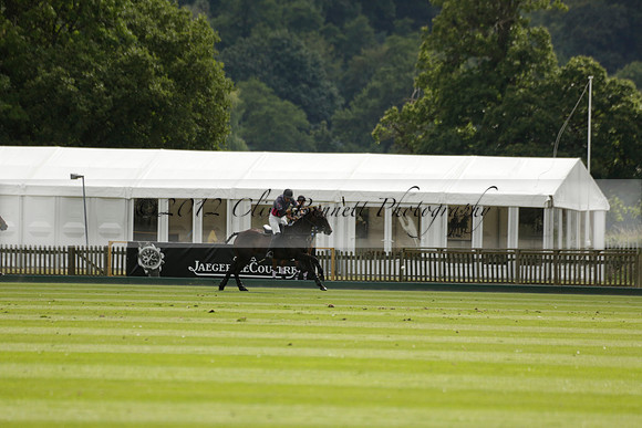 La Tremenda (lilac) v Maiz Dulce (yellow) in a Brecknock Cup polo match played on Lawns 1 at the Cowdray Park Polo Club on Tuesday 13 August 2013